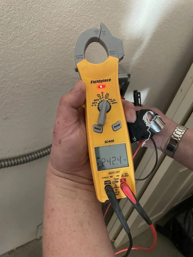 Voltage testing with clamp meter during Recessed Lighting Installation in Lancaster